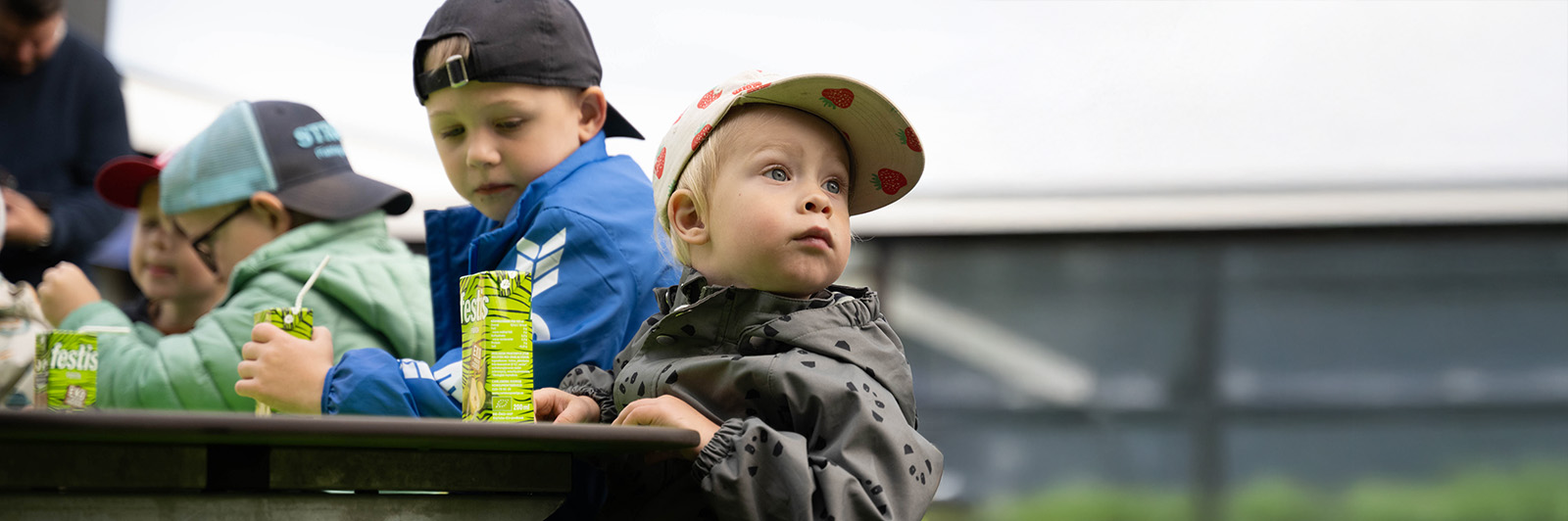 Boy enjoying a drink on the Hallon picnic table in HPL